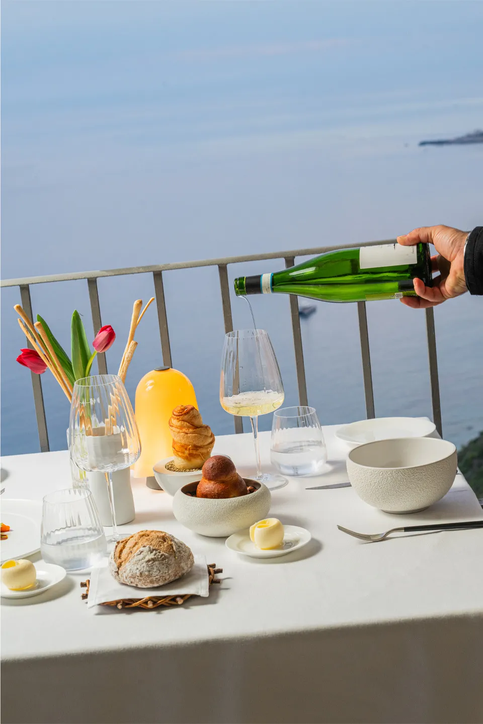 Set table with wine service and sea view at the restaurant of Hotel Metropole Taormina