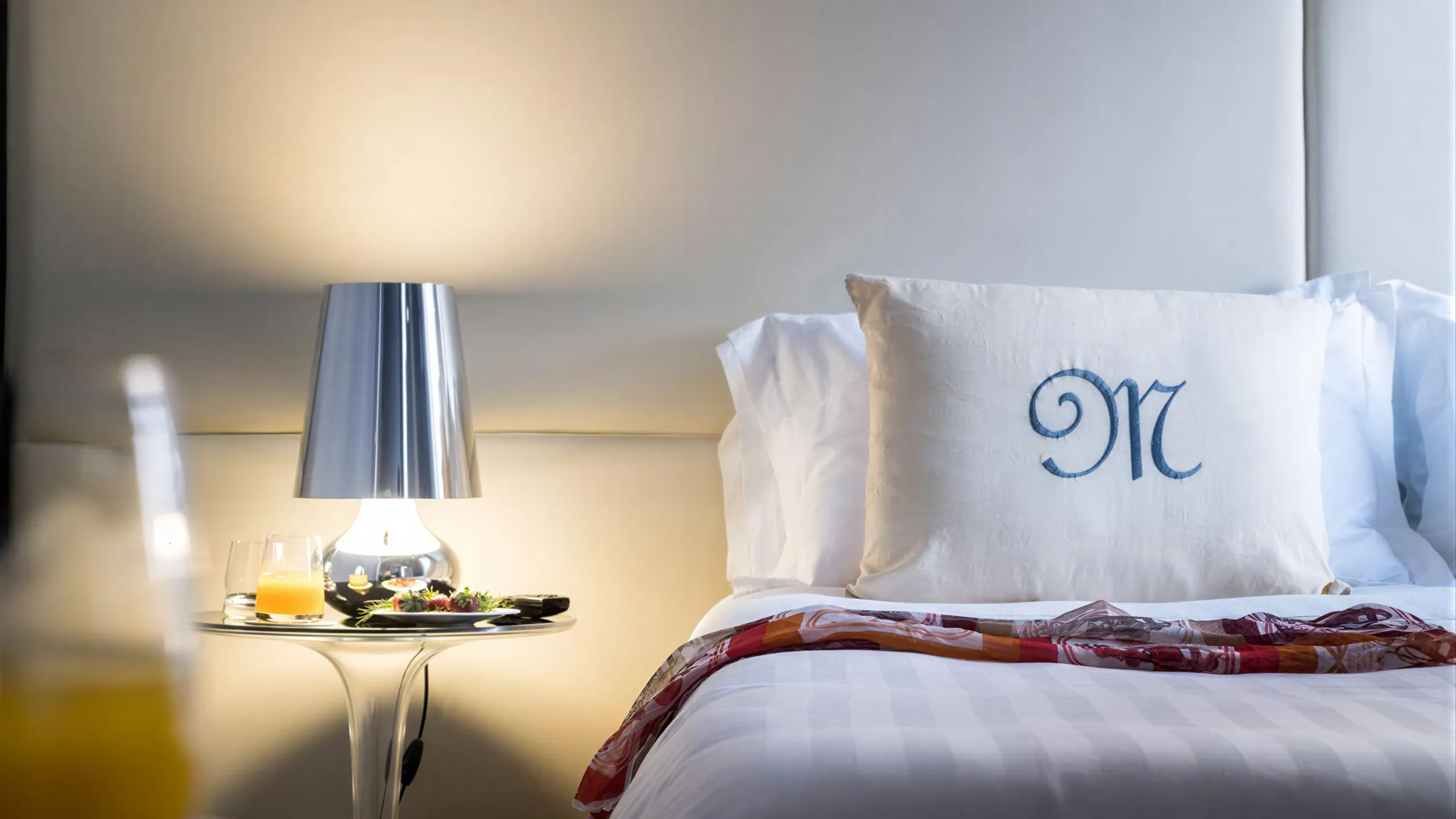 Detail of the Executive city view room at Hotel Metropole Taormina with bed and in-room service