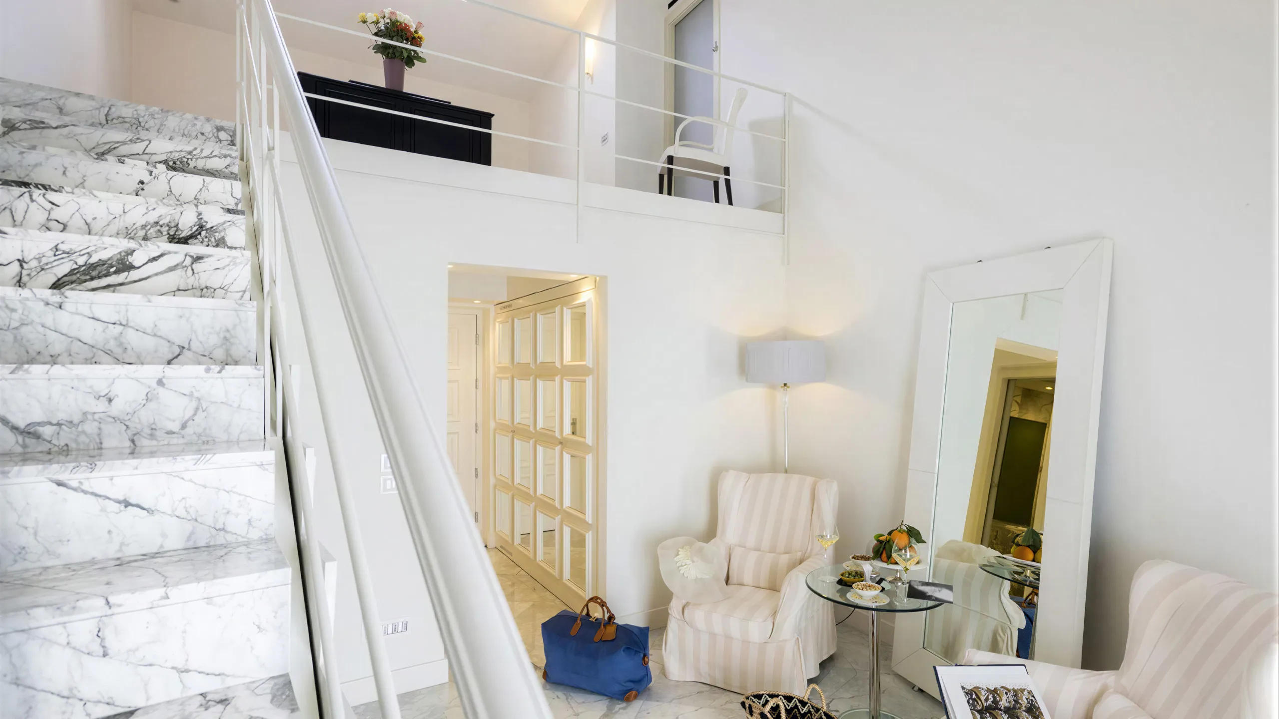 Living area of the Presidential Suite at Hotel Metropole Taormina with marble staircase and elegant furnishings